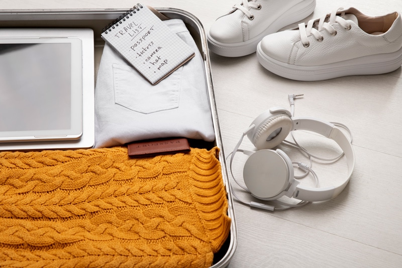 suitcase-with-headphones-passport-travel