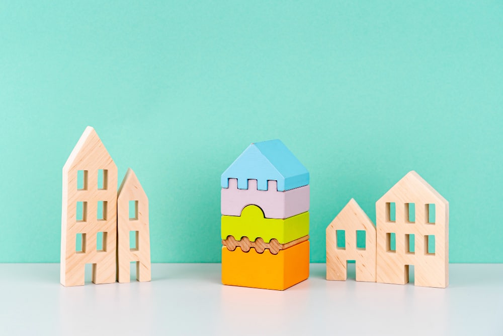 miniature-houses-blue-background
